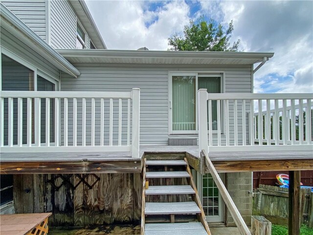 rear view of property with a wooden deck