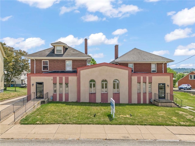 view of front of house with a front lawn