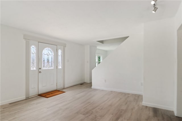 entrance foyer featuring light hardwood / wood-style floors