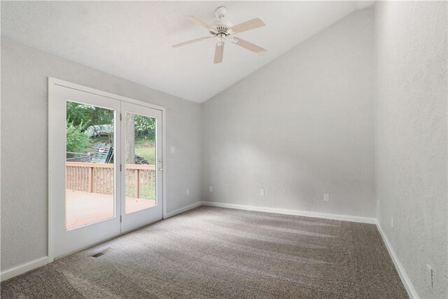 empty room with vaulted ceiling, carpet, and ceiling fan