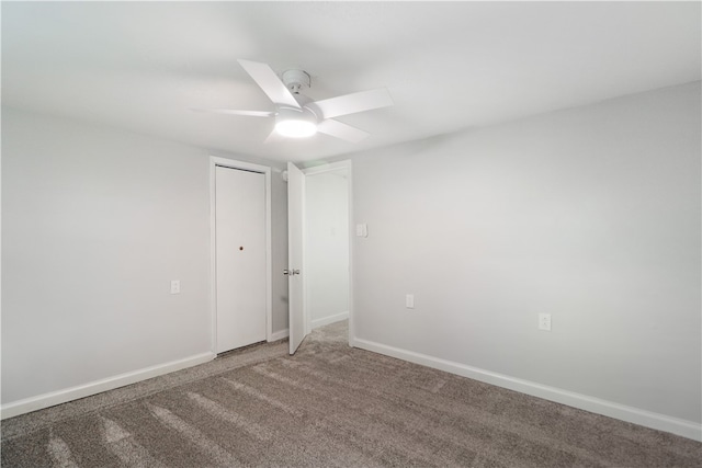 carpeted empty room with ceiling fan