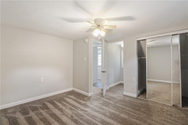 unfurnished bedroom with carpet flooring, a closet, and ceiling fan