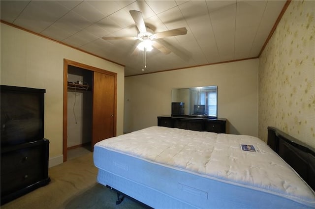 carpeted bedroom featuring a closet and ceiling fan