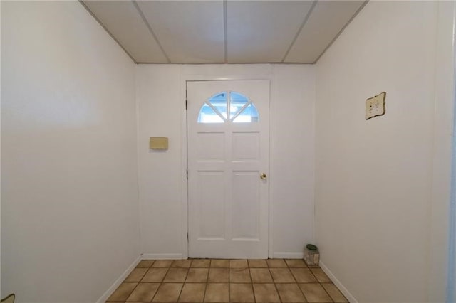 foyer entrance featuring light tile patterned flooring