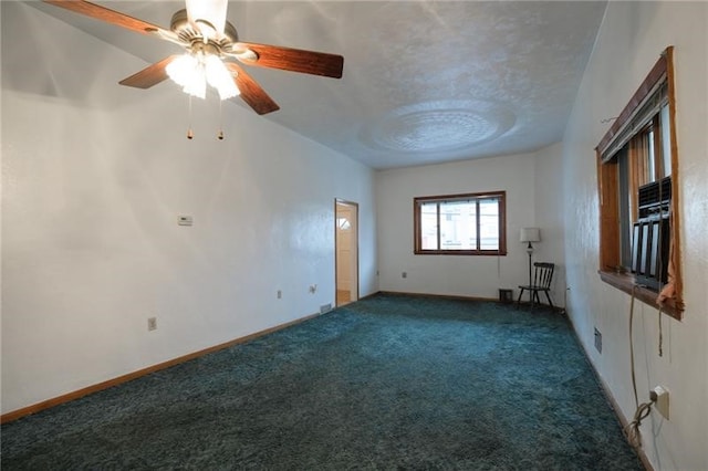 empty room with carpet floors and ceiling fan