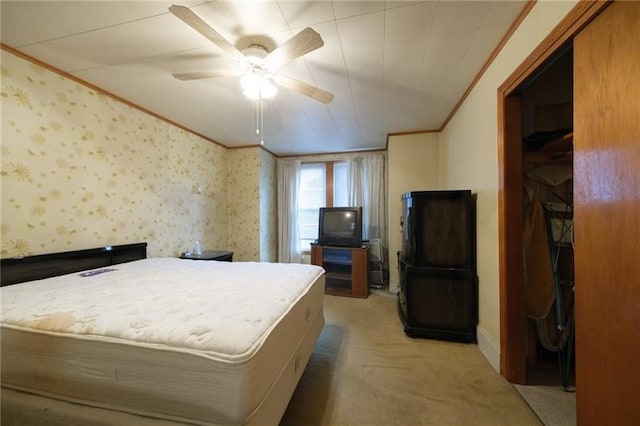 bedroom featuring ornamental molding, carpet floors, and ceiling fan