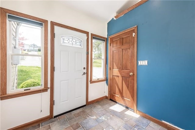 tiled entryway with a wealth of natural light