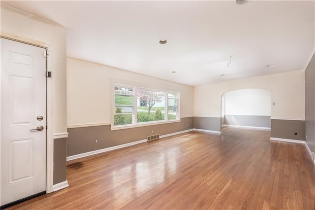 spare room with hardwood / wood-style flooring