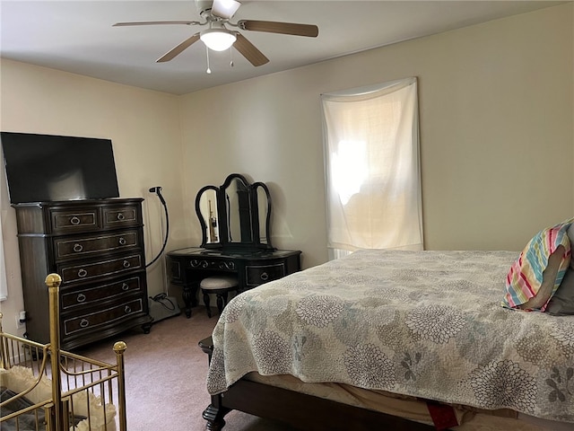 bedroom with light carpet and ceiling fan