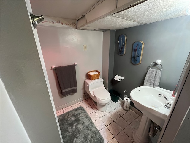 bathroom with toilet and tile patterned floors