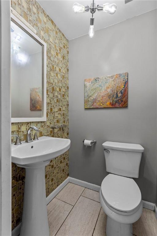 bathroom with tile patterned flooring and toilet