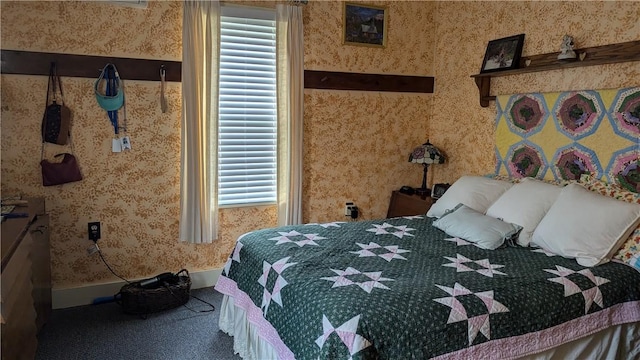 bedroom featuring carpet, baseboards, and wallpapered walls