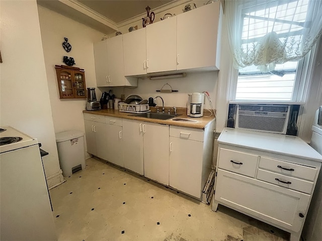 kitchen with sink, white cabinetry, white electric stove, and a healthy amount of sunlight