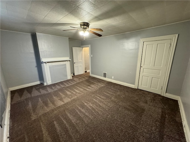 interior space with carpet flooring and ceiling fan