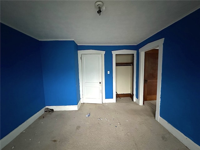 unfurnished bedroom featuring light colored carpet