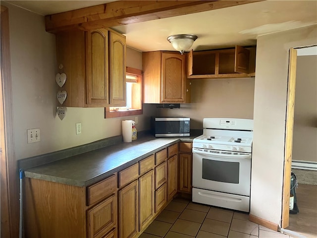 kitchen with tile patterned flooring, white stove, and a baseboard radiator