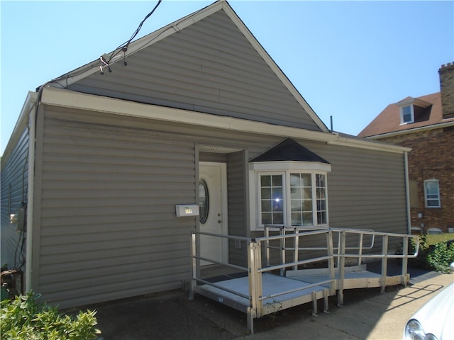 rear view of property with a deck