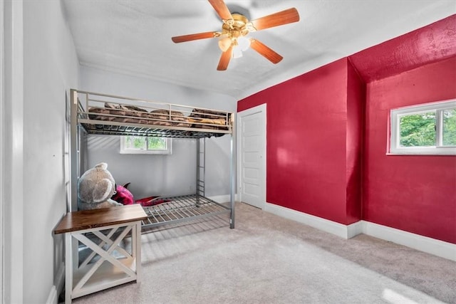 carpeted bedroom featuring ceiling fan