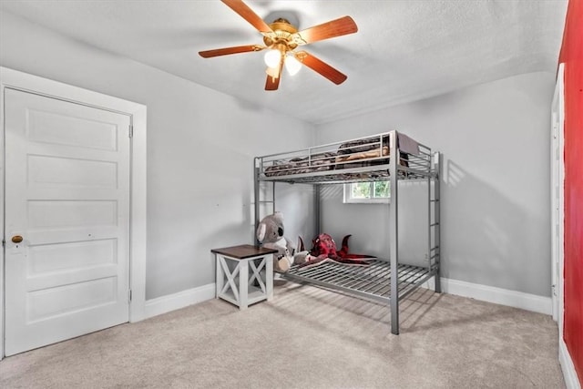 bedroom featuring ceiling fan and light colored carpet