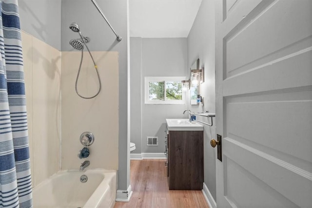 full bathroom with shower / bath combination with curtain, vanity, toilet, and hardwood / wood-style floors