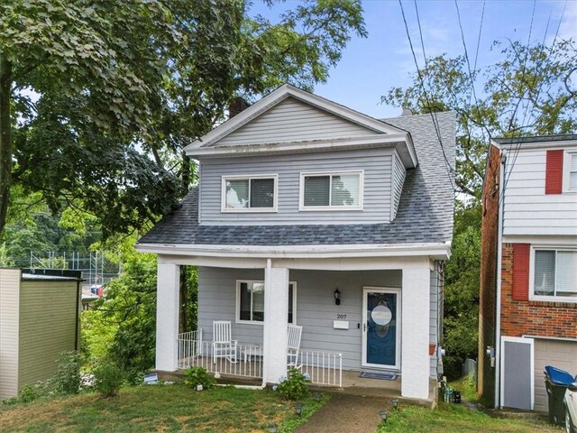 view of front of house with covered porch and a garage