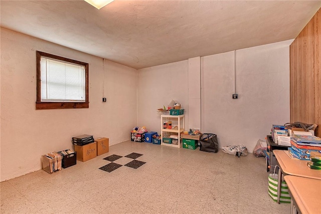 recreation room with tile patterned floors