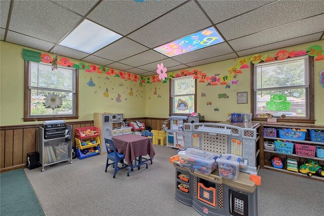 game room featuring a drop ceiling and carpet floors