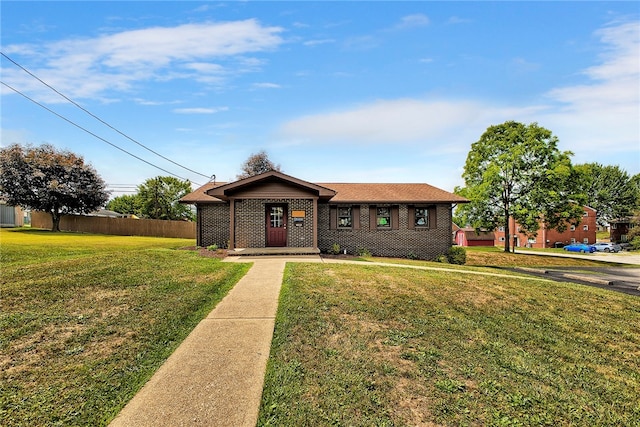 single story home featuring a front yard