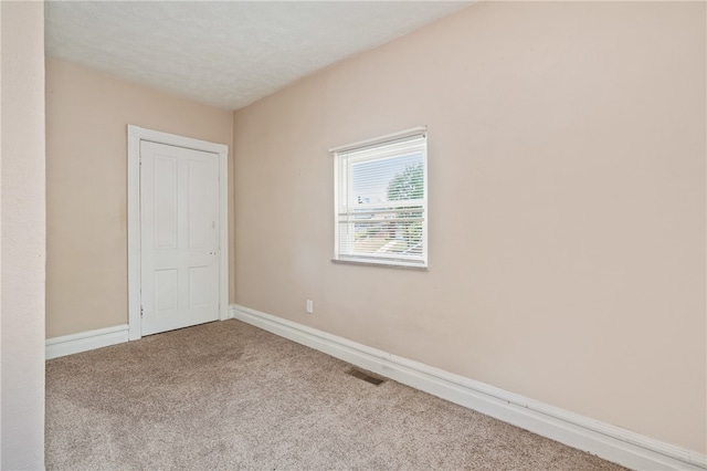 unfurnished bedroom featuring carpet