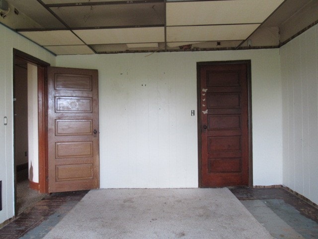 empty room featuring a paneled ceiling