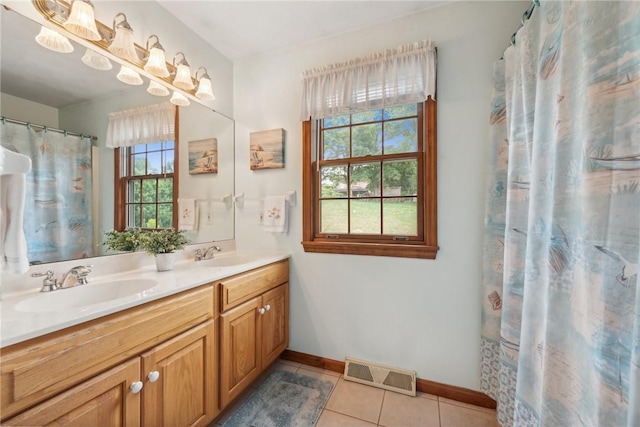 bathroom featuring a shower with curtain, tile patterned flooring, and vanity