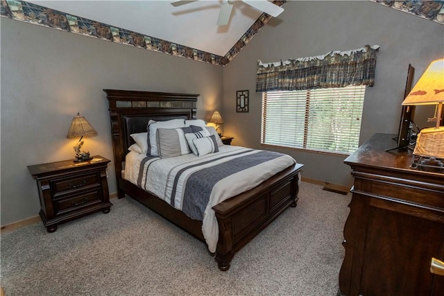 bedroom featuring ceiling fan, light colored carpet, and vaulted ceiling