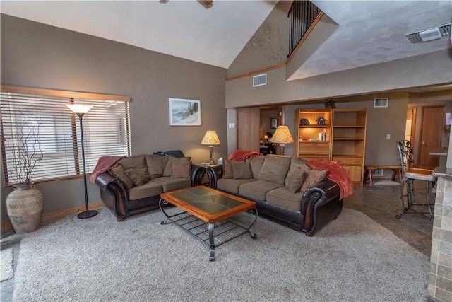 living room featuring carpet and high vaulted ceiling