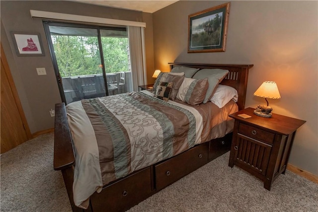 bedroom featuring access to exterior and carpet floors