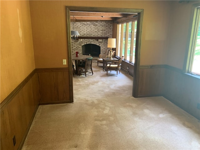 interior space featuring plenty of natural light and a brick fireplace