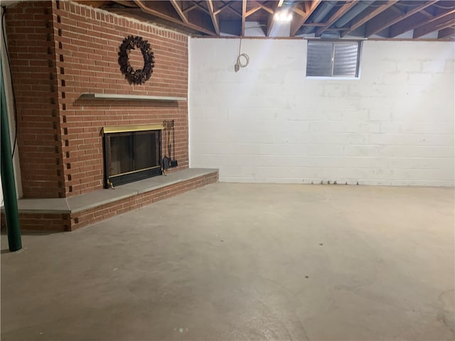 basement with a brick fireplace