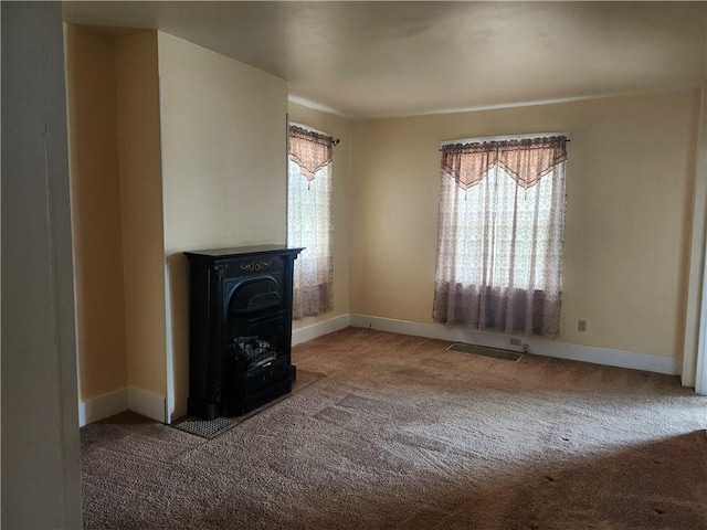 unfurnished living room featuring carpet flooring