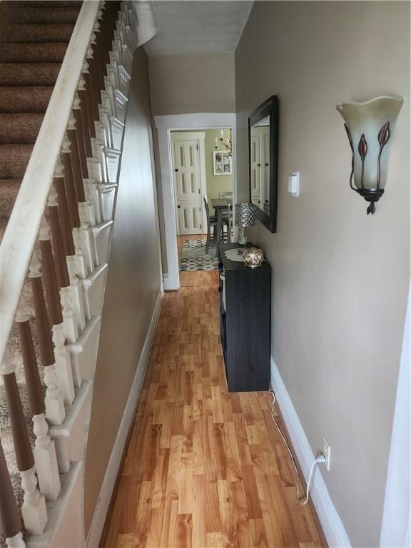 hall with light wood-type flooring