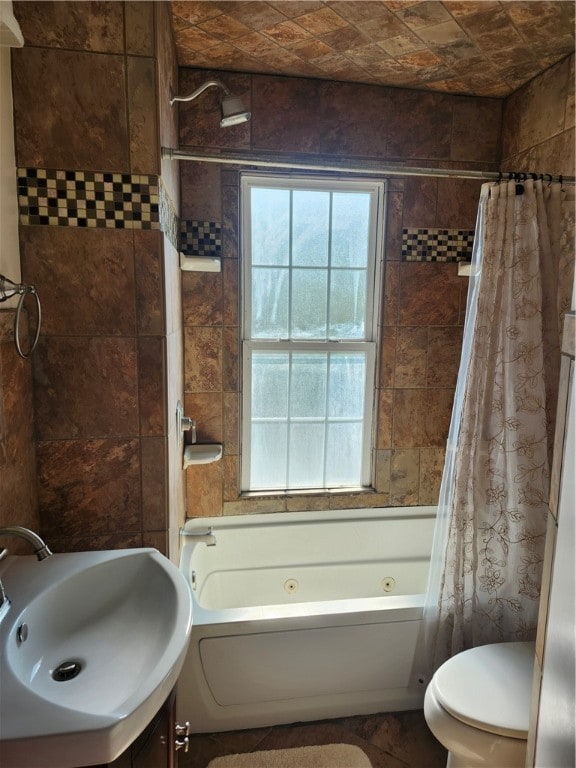 full bathroom featuring vanity, shower / bath combo, and toilet