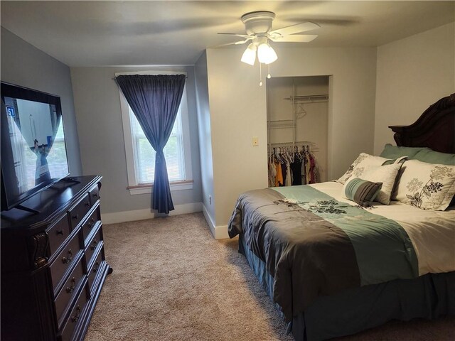 carpeted bedroom with a closet and ceiling fan