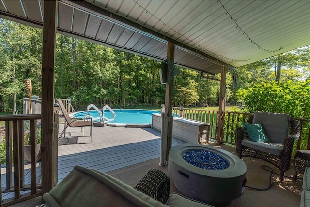 deck featuring an outdoor fire pit