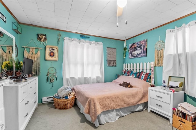 carpeted bedroom with baseboard heating, ceiling fan, and ornamental molding