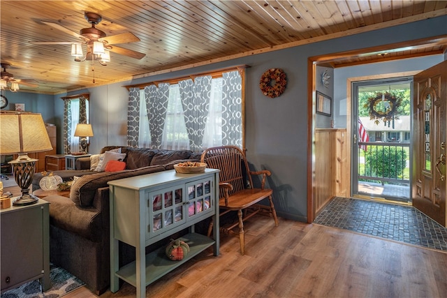 living room with ceiling fan, wood ceiling, hardwood / wood-style floors, and ornamental molding