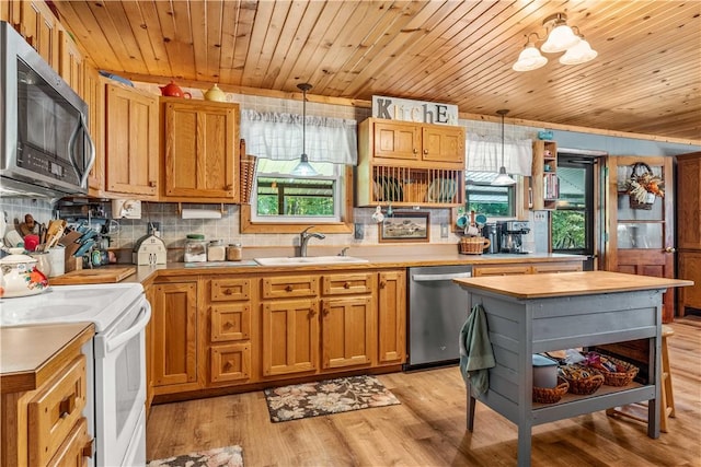 kitchen with appliances with stainless steel finishes, decorative light fixtures, and wooden ceiling