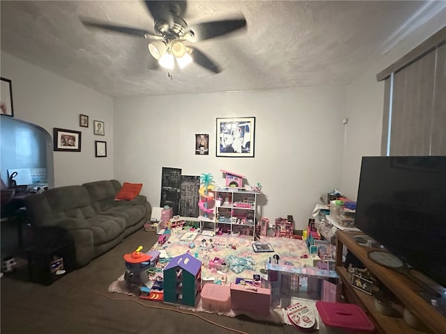 carpeted living room featuring ceiling fan