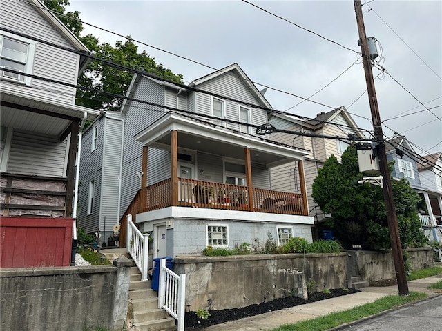 view of front of house featuring a balcony