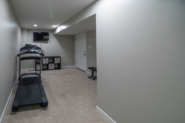 workout area featuring carpet flooring