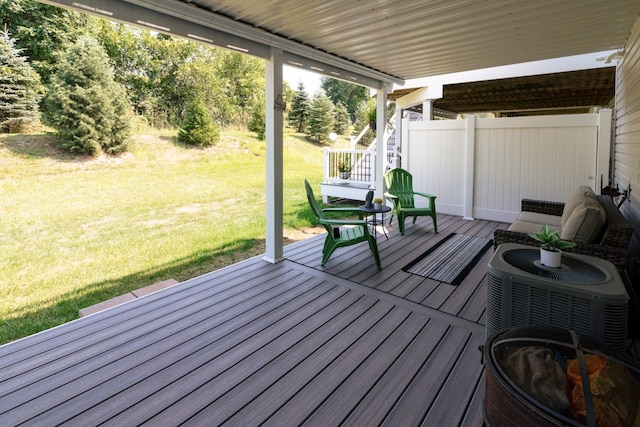 wooden deck featuring a yard