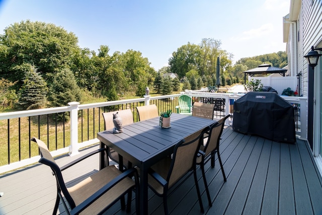 wooden terrace with area for grilling