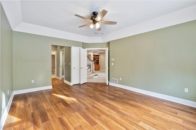 spare room with hardwood / wood-style flooring and ceiling fan